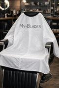 My-Blades white professional barber cape with waterproof neckline in barbershop