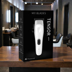 My-Blades Tensor1 retail packaging featuring the white clipper displayed on a wooden barber workstation with a barbershop interior softly blurred in the background.