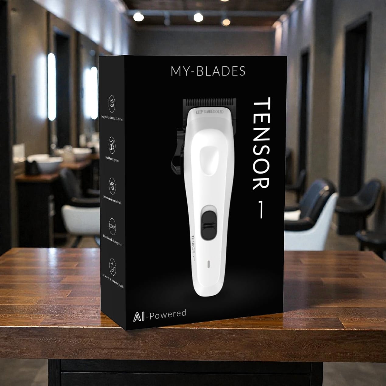 My-Blades Tensor1 retail packaging featuring the white clipper displayed on a wooden barber workstation with a barbershop interior softly blurred in the background.